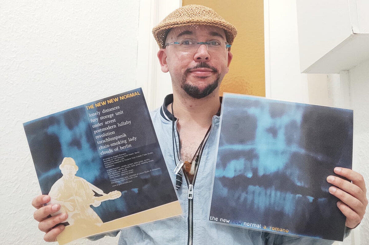 Angelo Romano holding his vinyl record 'The New New Normal' Angelo Romano holding his vinyl record 'The New New Normal'